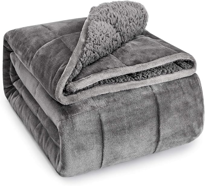 Wemore sherpa fleece weighted blanket, 15 lb twin, in grey — the fluffy reverse side visible on the fold.